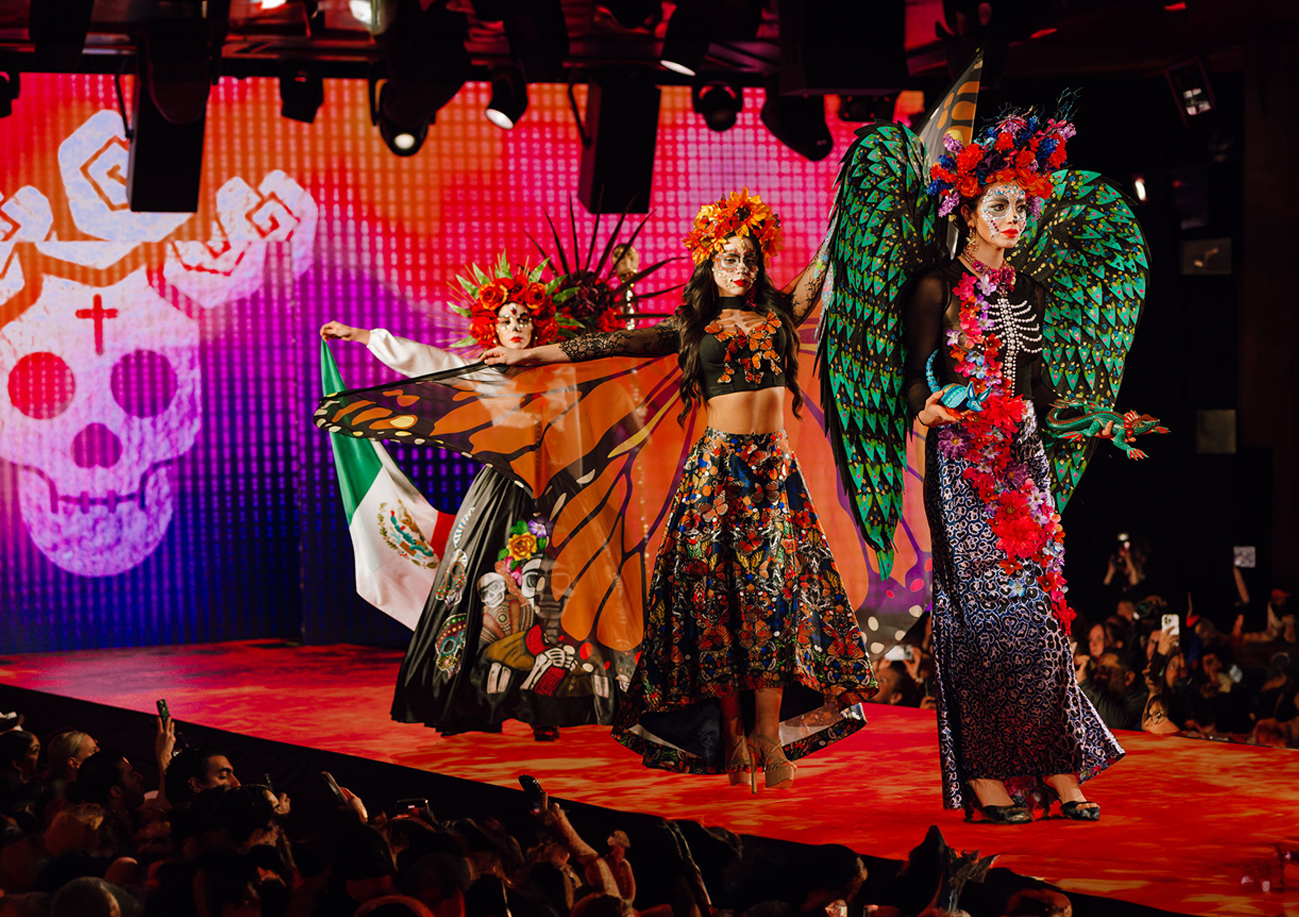 Our runway presentations are more than fashion shows—they are immersive narratives that honor the soul of Mexican culture. Each collection—whether Elements of Essence, Elements of the Ofrenda, Fantastical Offerings, or Voices of Mexico—weaves a visual story through meticulously crafted designs rooted in ancestral symbolism.