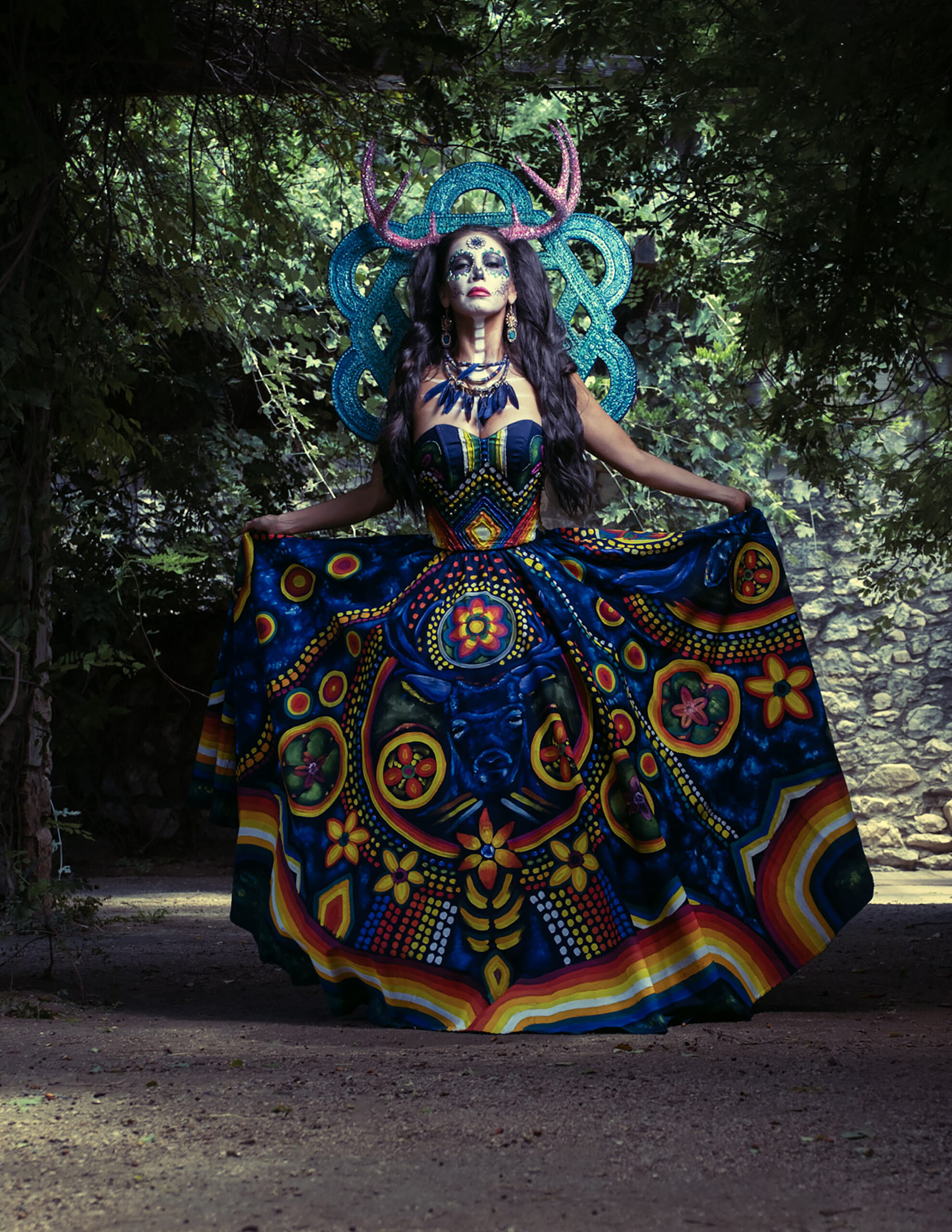 Catrina Wixárika honors the sacred symbols and living traditions of the Wixárika people through a couture icon inspired by the blue deer, peyote, and Tsikuri, reflecting a profound connection between humanity, nature, spirituality, and the cosmos.