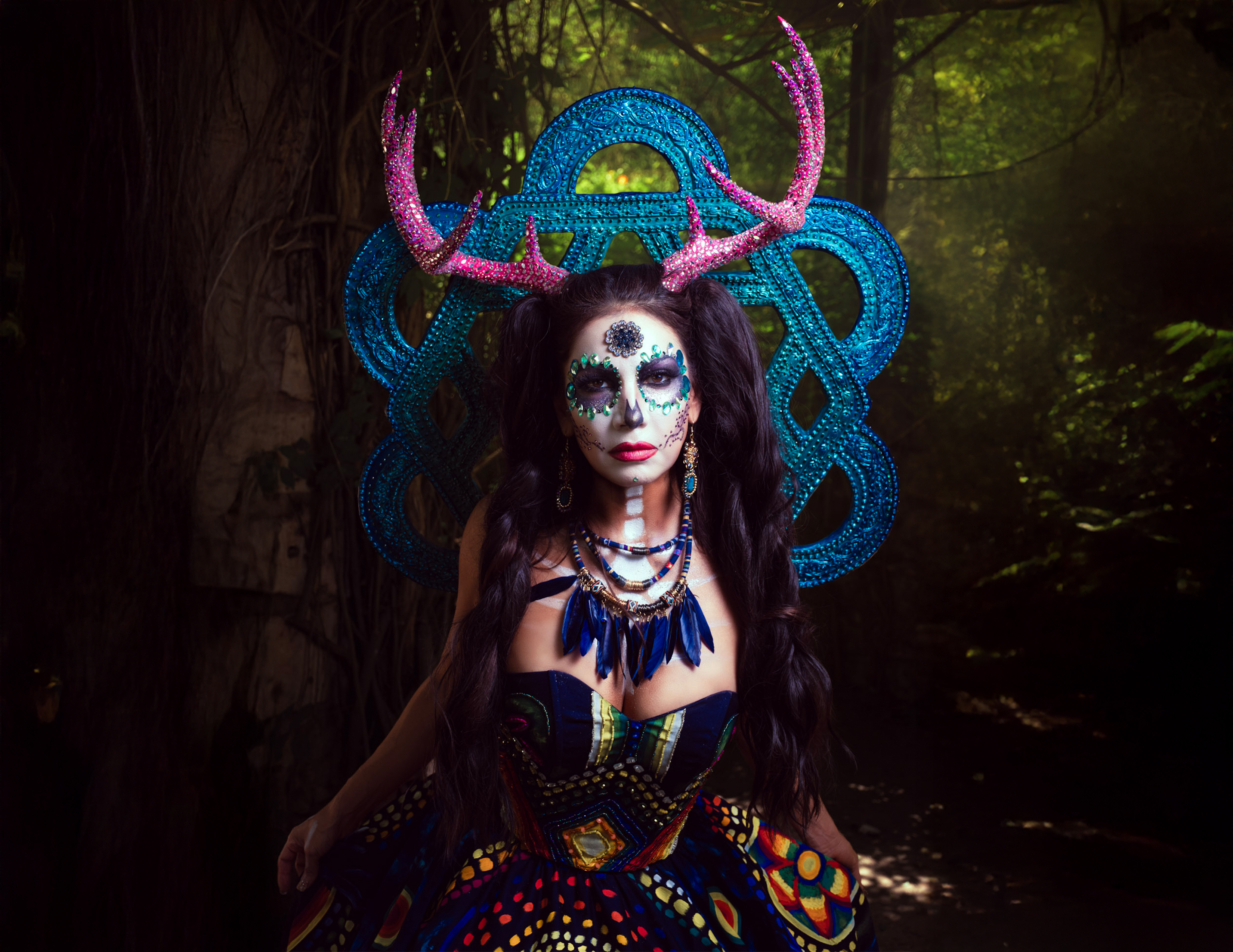 Catrina Wixárika honors the sacred symbols and living traditions of the Wixárika people through a couture icon inspired by the blue deer, peyote, and Tsikuri, reflecting a profound connection between humanity, nature, spirituality, and the cosmos.